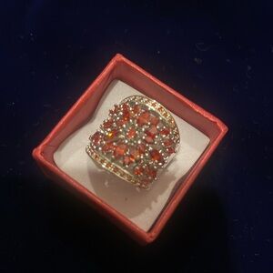 Women's ring with red rhinestones on silver